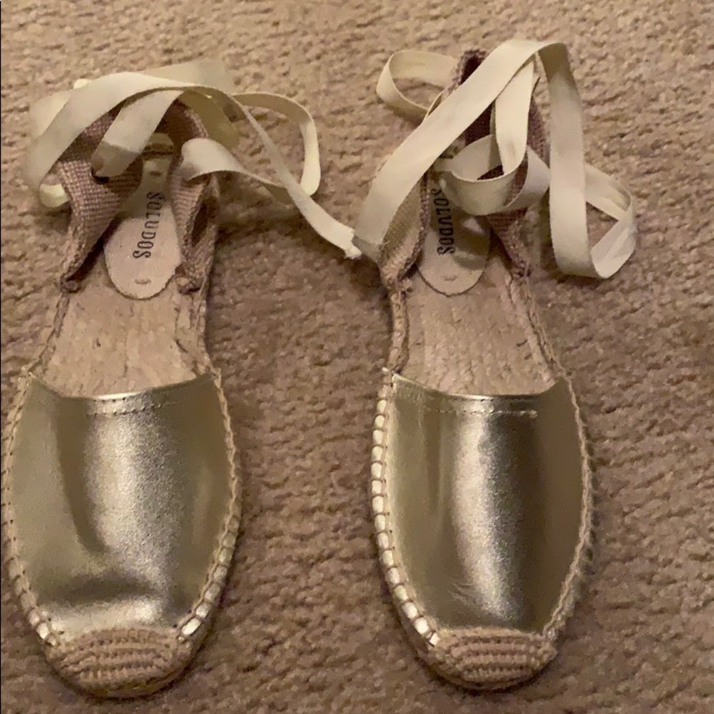 Gold Soludos espadrille lace up sandals.